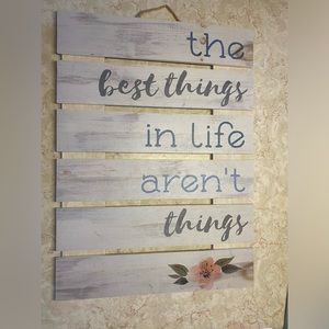 Best things in life aren’t things sign